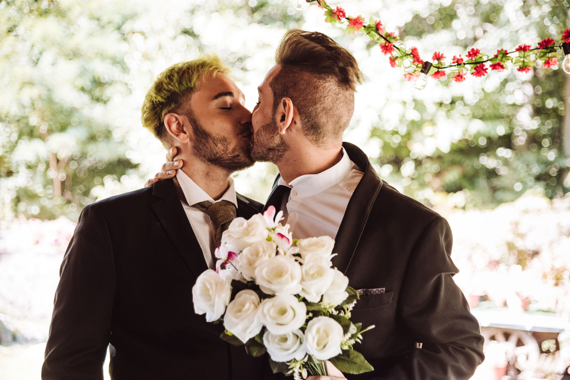 gay couple kissing at their wedding