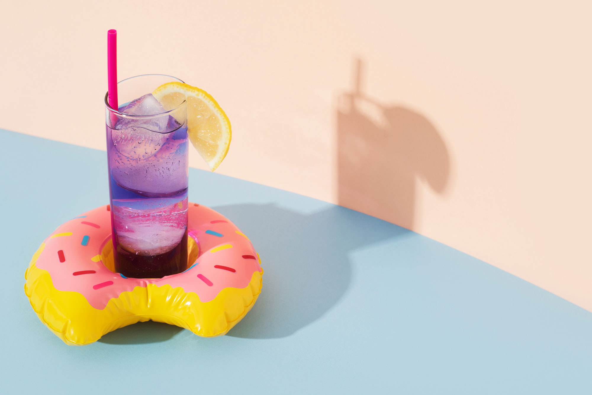 Swim ring in the shape of a donut with a cocktail