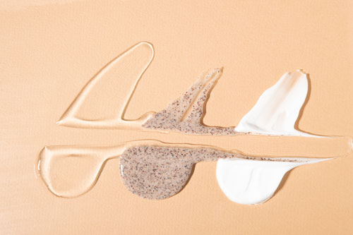Samples of cosmetic products on a beige background