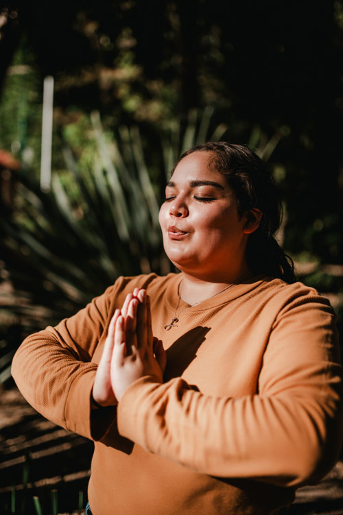 Woman meditating at the park