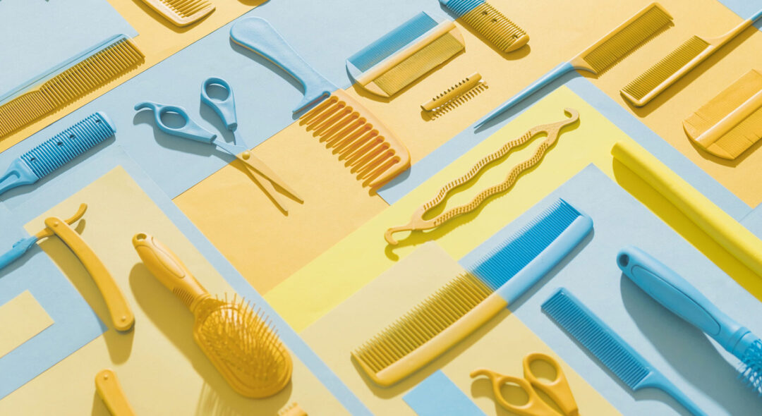 still life of different hair brushes and styling tools