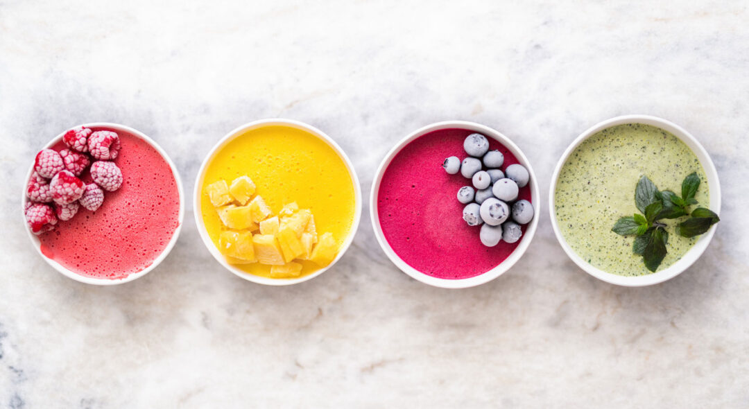 overhead shot of 4 bowls of yogurts