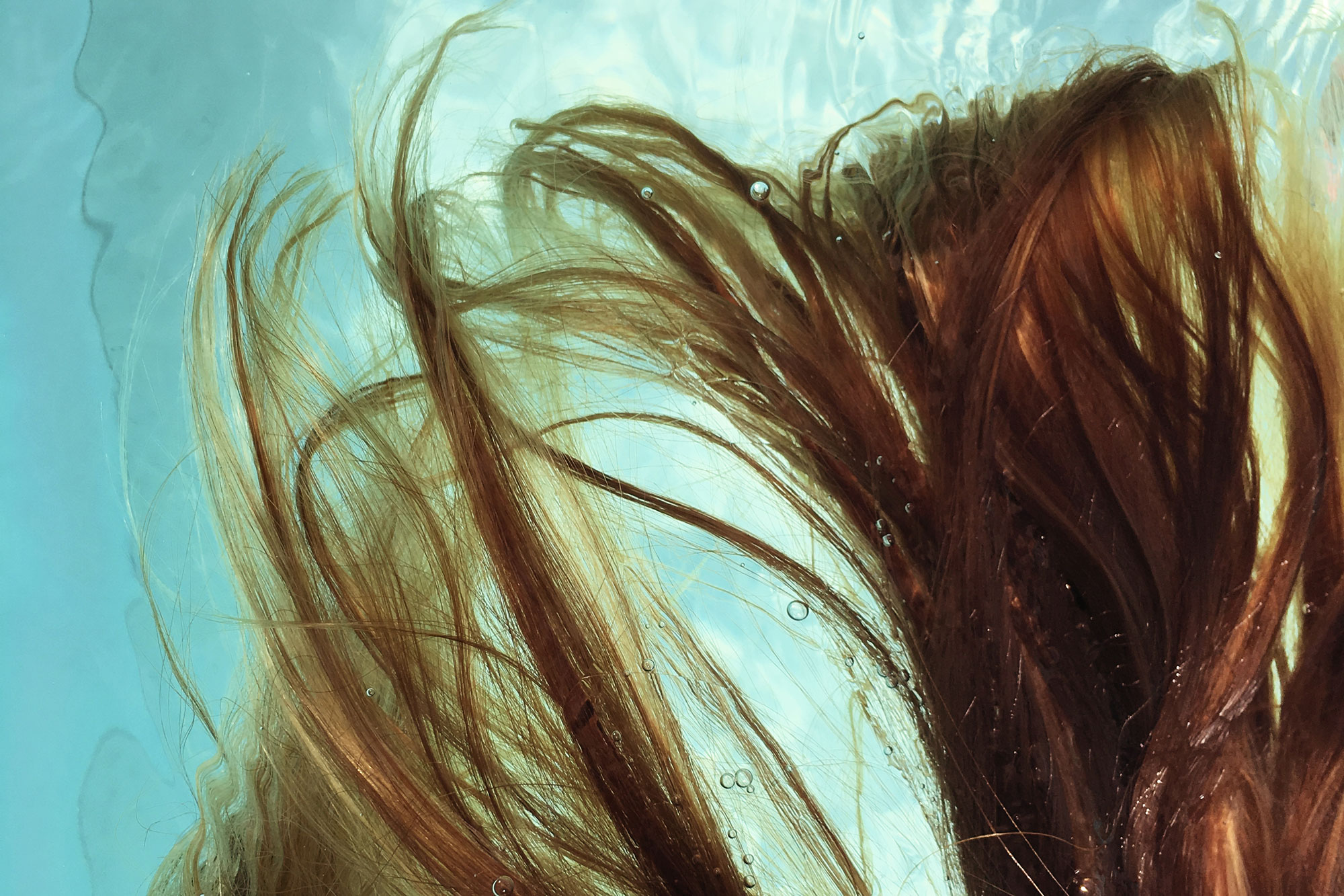 Close Up Of Hair From A Person Swimming In A Pool