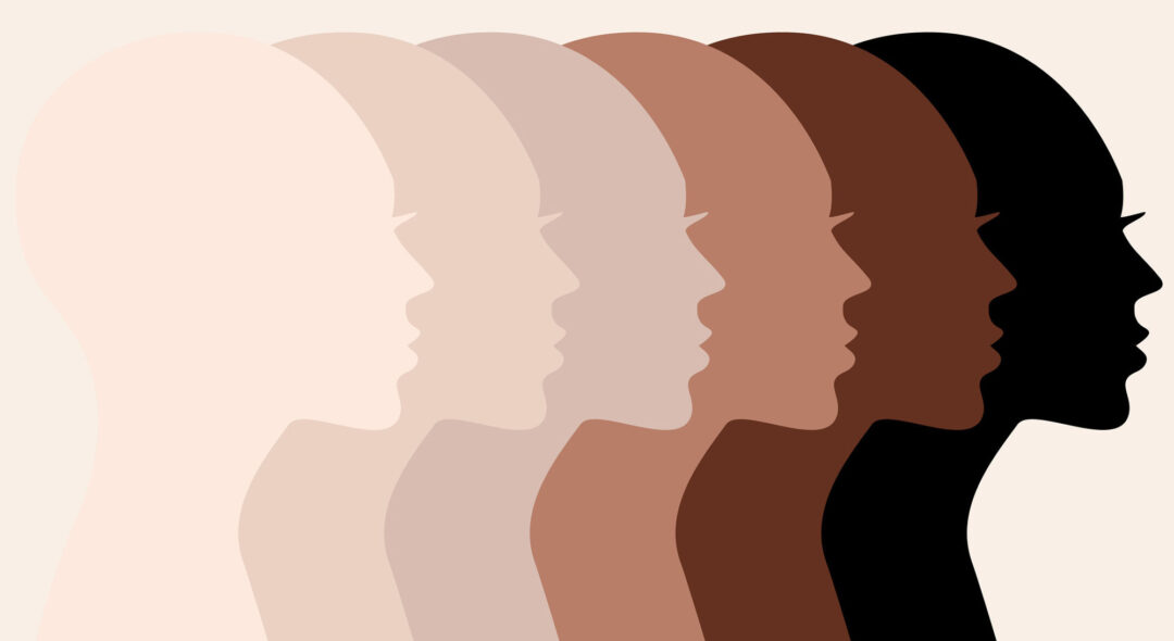 Female profile silhouettes, different skin colors