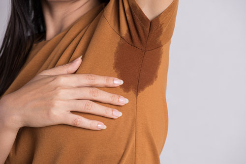 close up woman with sweaty under arm shirt