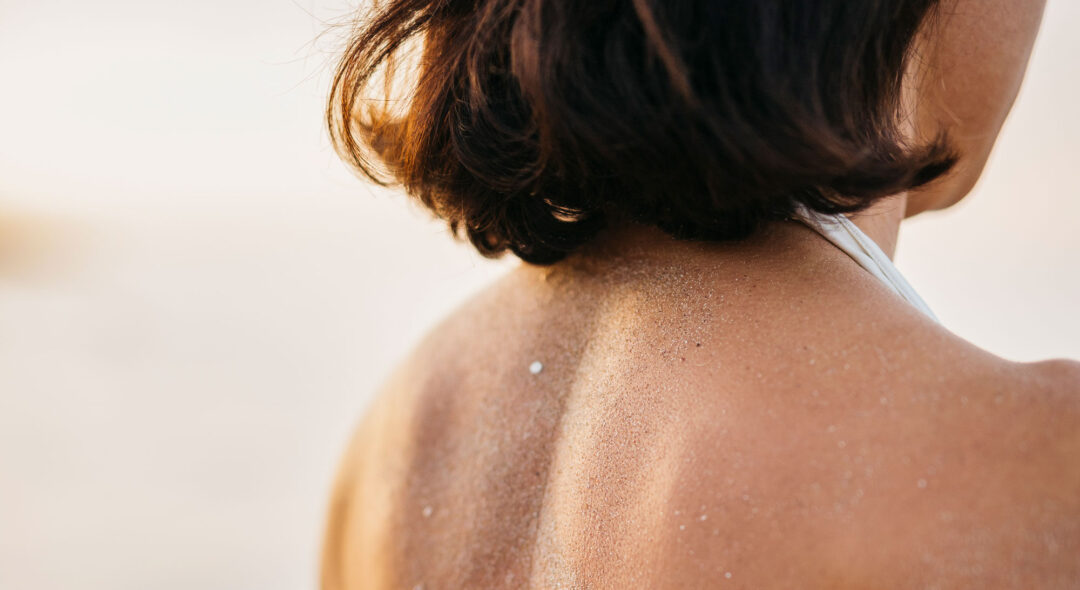 close up of woman's back at the beach