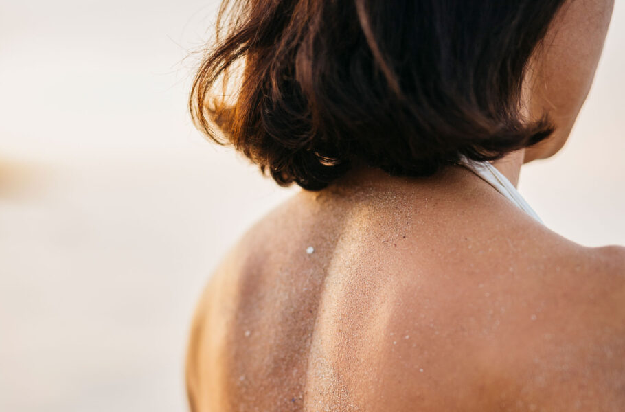 close up of woman's back at the beach