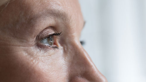 close up shot of woman looking into distance