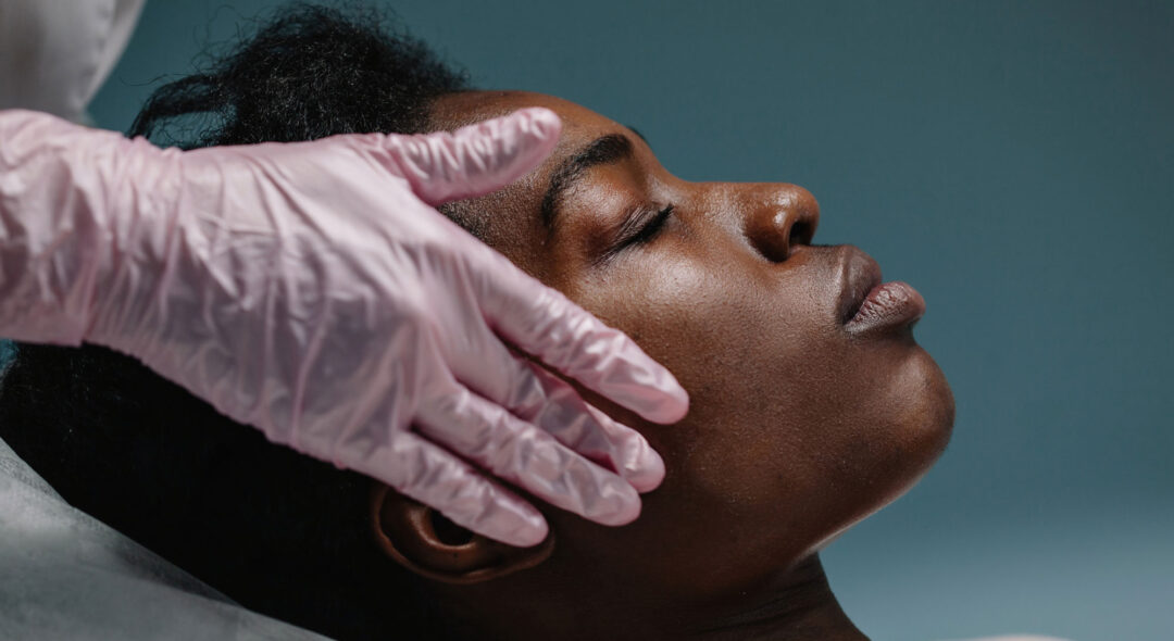 woman getting a facial procedure at spa