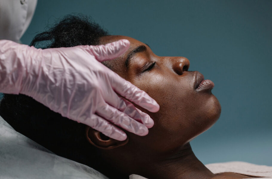 woman getting a facial procedure at spa