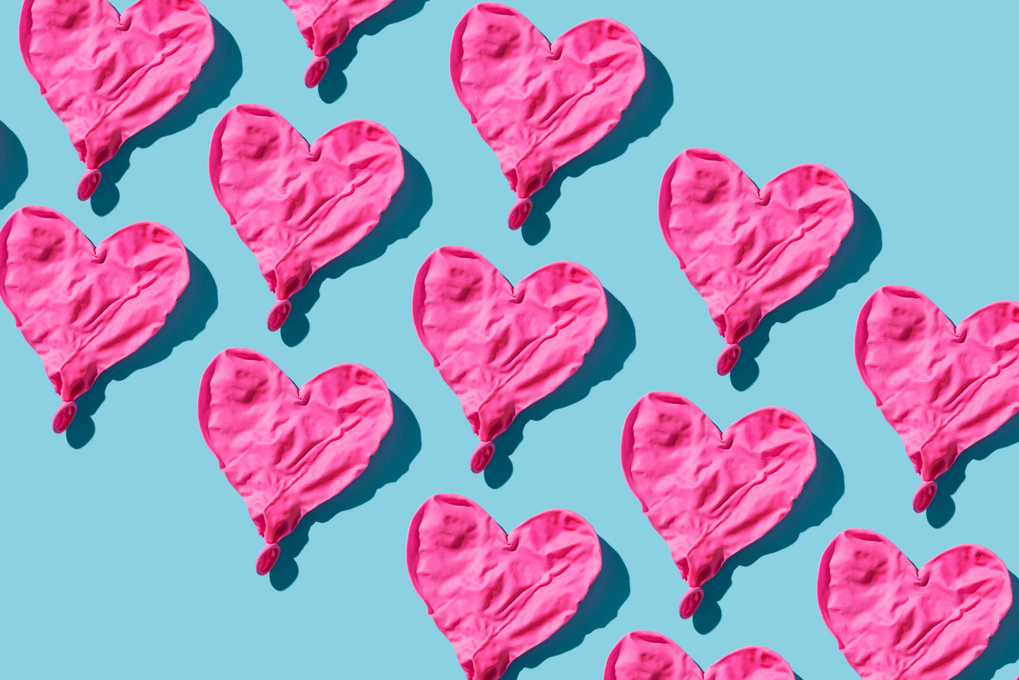 deflated hearts on blue background