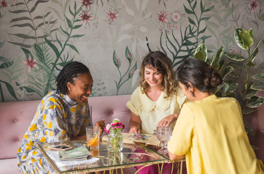 group of women at table looking at crafts