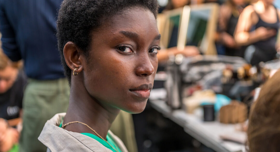 model backstage getting ready for a fashion week show