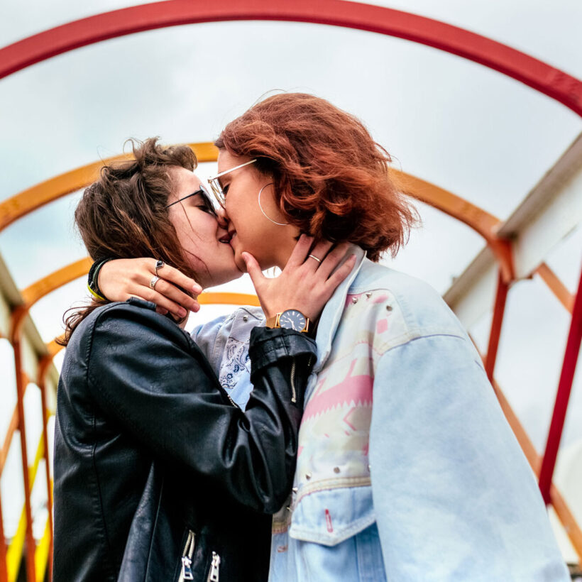 women kissing each other