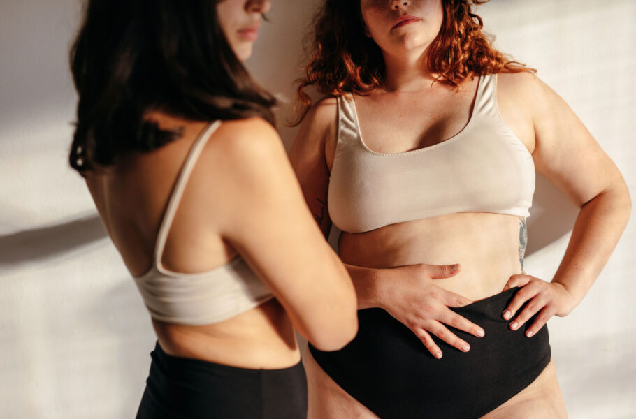two women in studio wearing underwear