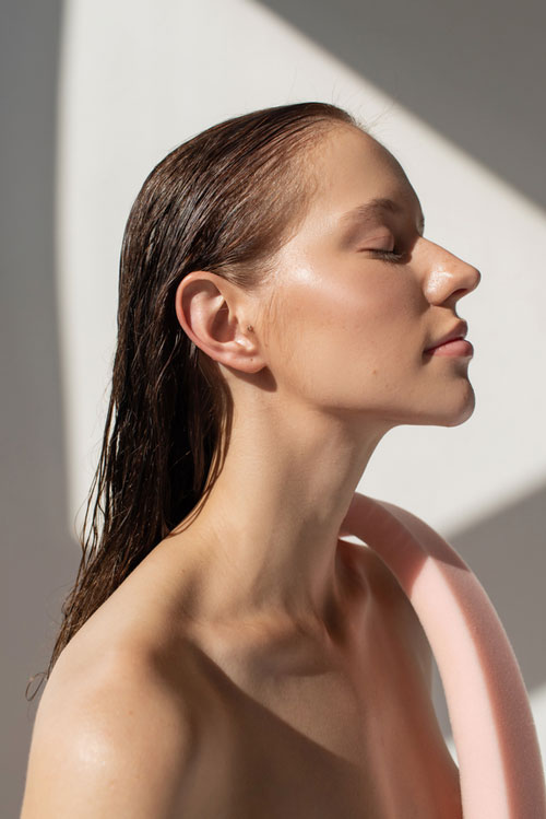 side profile of woman with wet hair