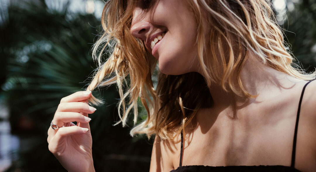 close up of woman touching hair
