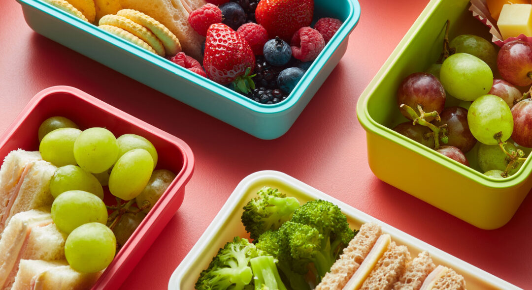 Healthy food in colorful lunchboxes