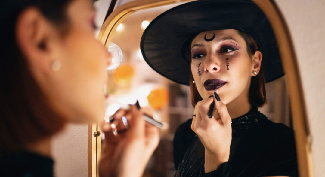 woman applying halloween make-up