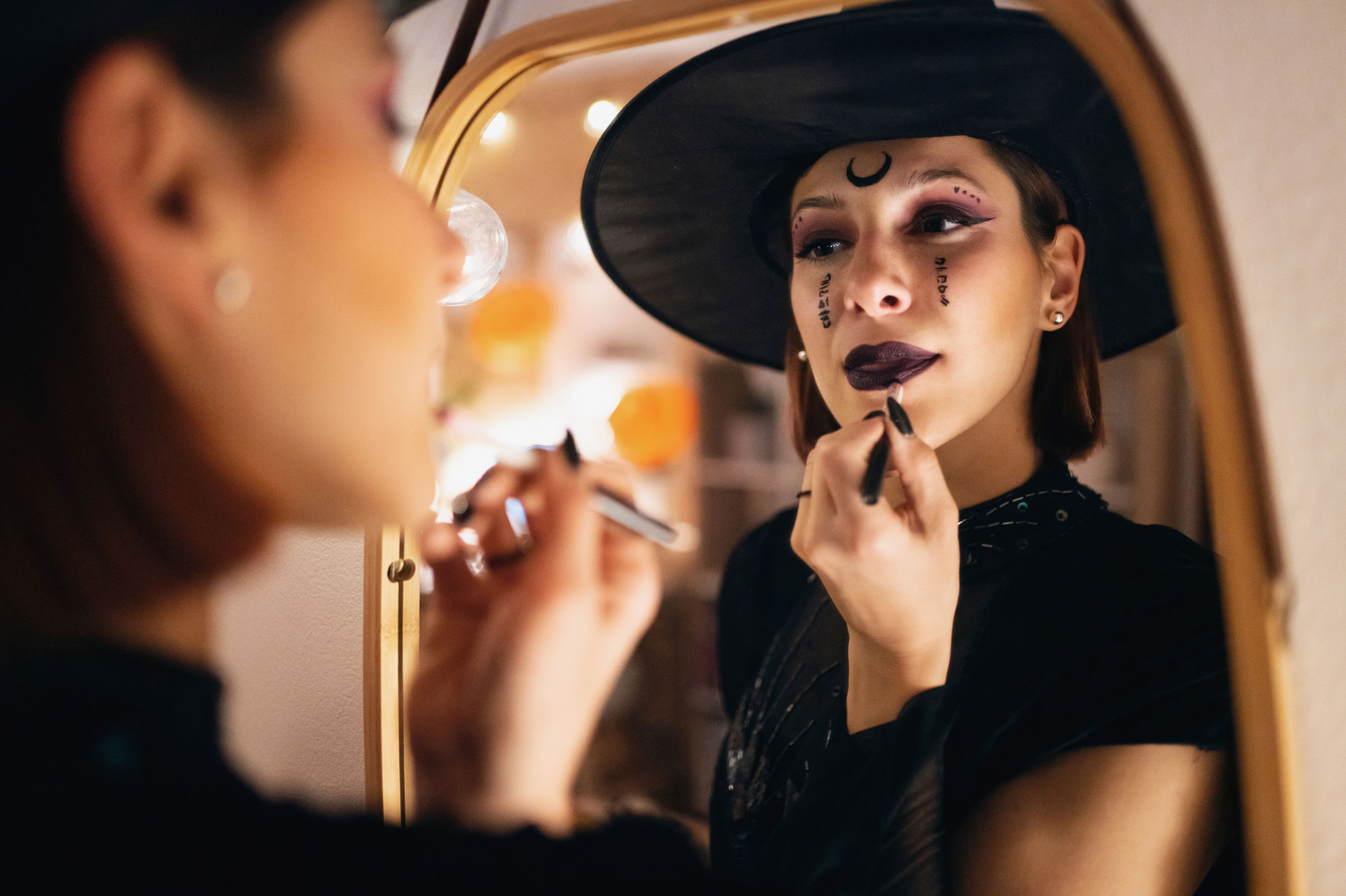woman applying halloween make-up