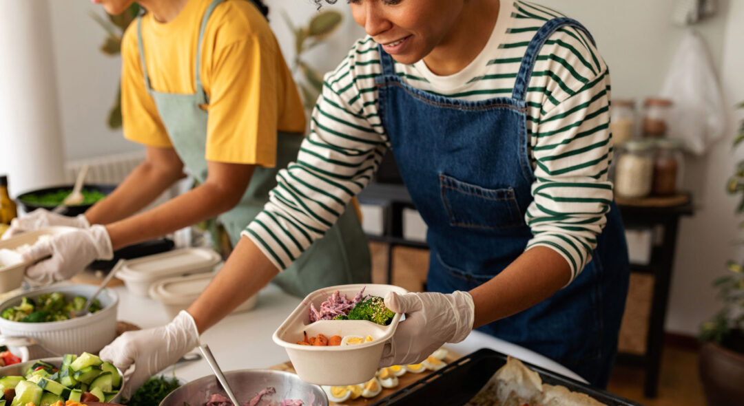 Women preparing lunches on lunch boxes