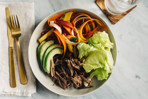 Pulled pork with carrot salad and avocado
