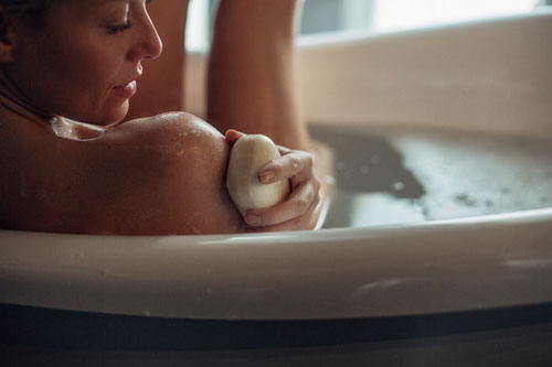 Woman Washing Her Shoulder With a Soap
