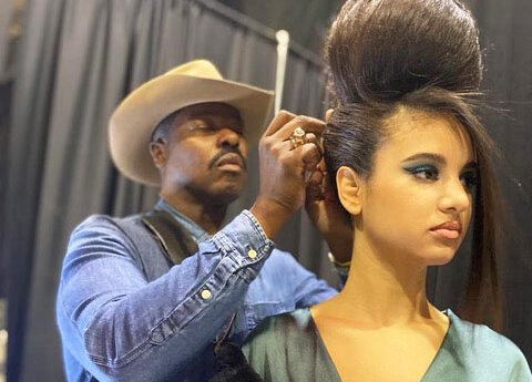 Ted Gibson styling model's hair