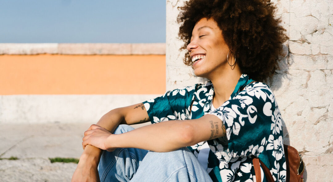 woman relaxing while sitting on the ground
