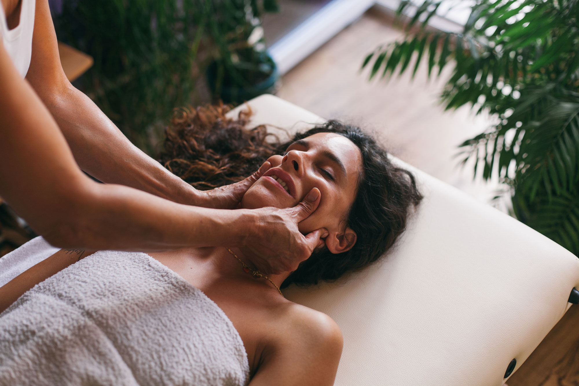 Woman having facial massage