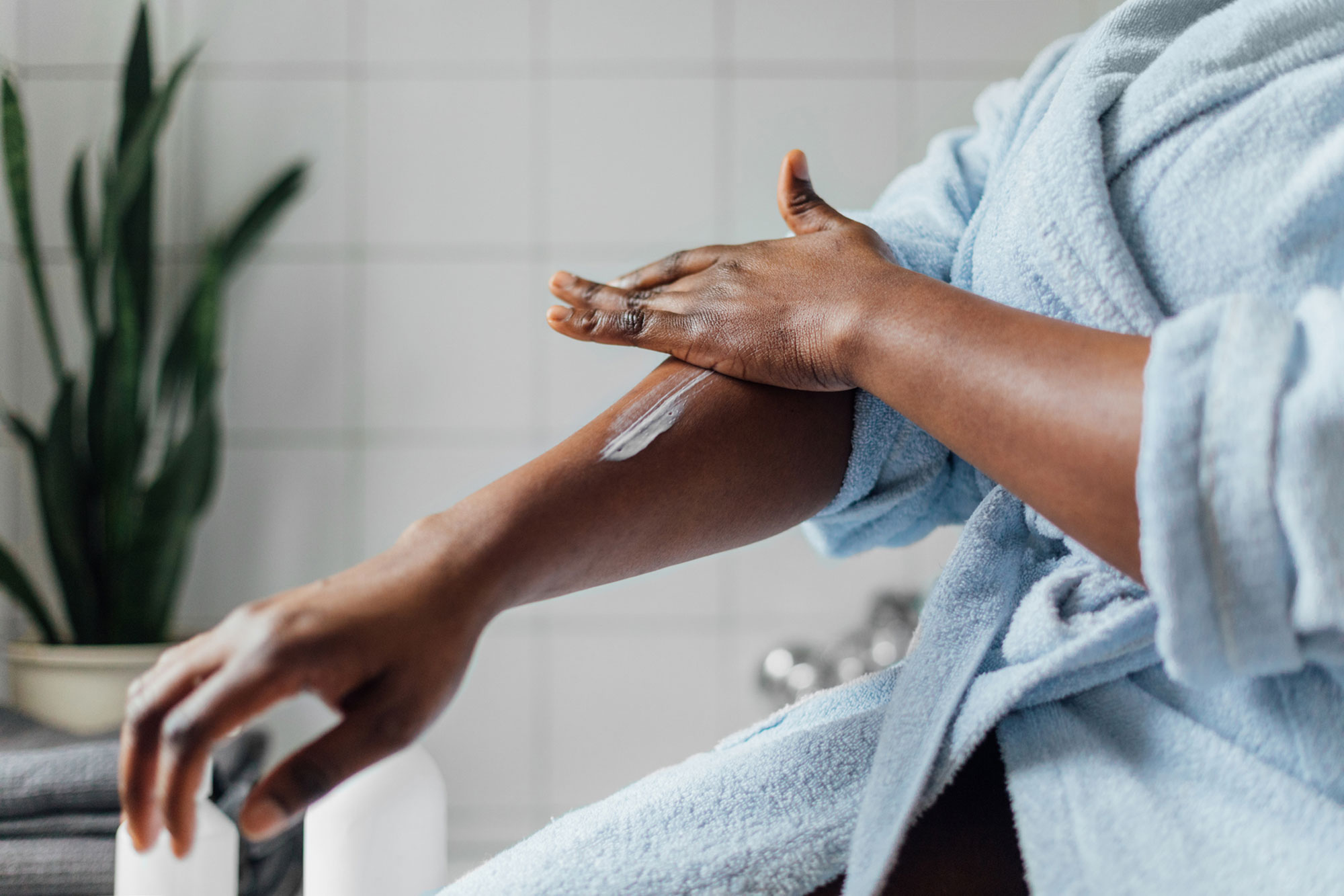 Woman Applying Body Lotion