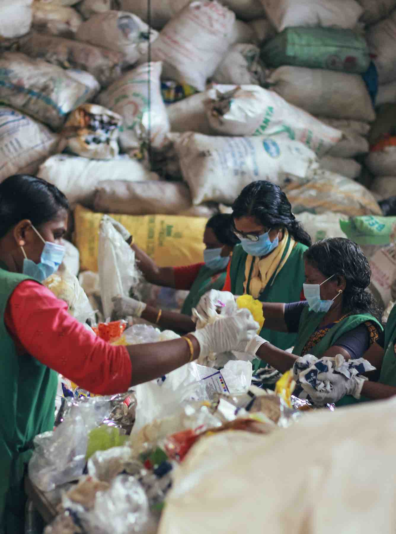 Green Worms workers sorting litter